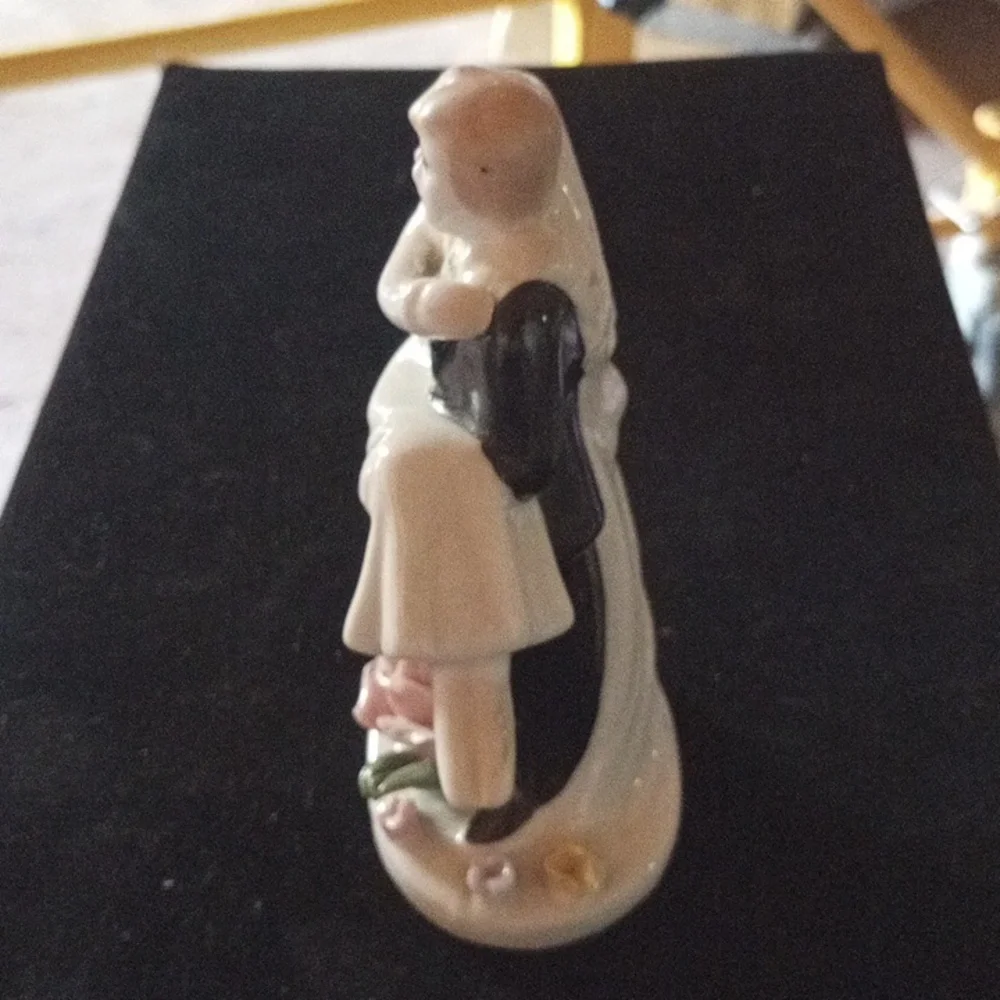 Porcelain Figurine with Floral Base